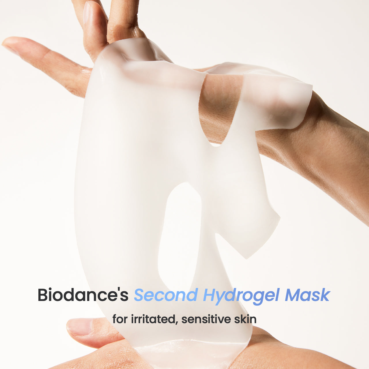 Biodance's Second Hydrogel Mask being held by a hand on a white background